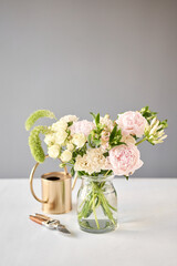 Beautiful flower arrangement in a glass vase. Flowers bunch, set for interior. Fresh cut flowers for decoration home. European floral shop. Delivery fresh cut flower.v