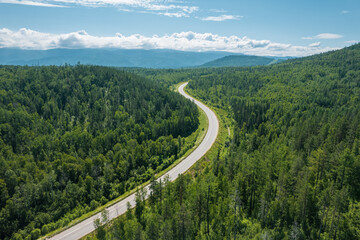 Zigzag road in the West Siberian taiga ecoregion. Baikal, Russia.