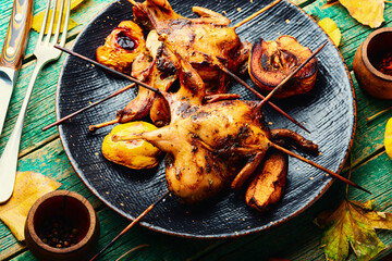 Quail barbecue with quince