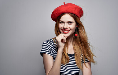 cheerful woman wearing a red hat makeup France Europe fashion posing isolated background