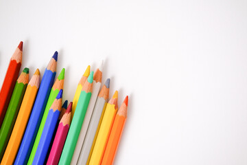 Colored pencils on a white background. Place for your text. Copy space. Mockup