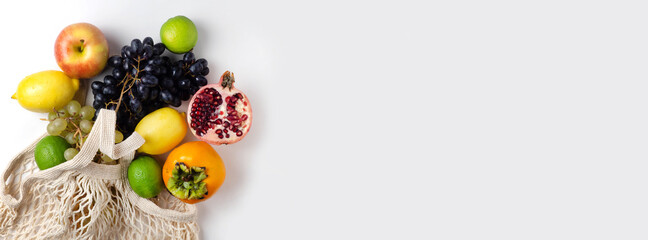 Fruits in an eco-bag on a white background.