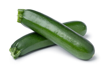 Pair of fresh green whole zucchini isolated on white background