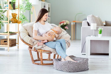 Photo of dreamy pretty lady wear white t-shirt smiling sitting chair holding arms hands rocking...