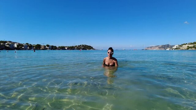 Woman Swimming in the Sea. Locked sea level.
