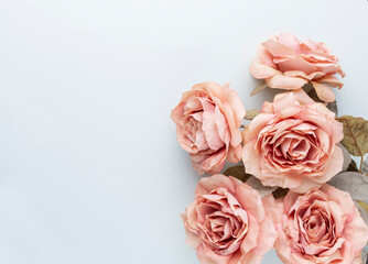 Flowers composition. Bouquet of pink roses in pastel colors. Flatlay.