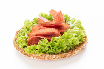 Sandwich with salami sausage on white background.