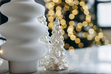 decorative christmas tree on background of bokeh garlands