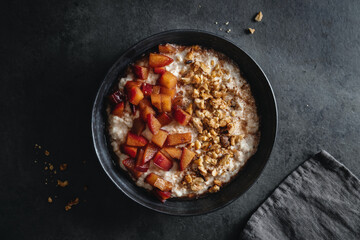Porridge with plums walnuts and cinnamon