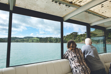 couple looking at the ocean, bay of islands, new zealand