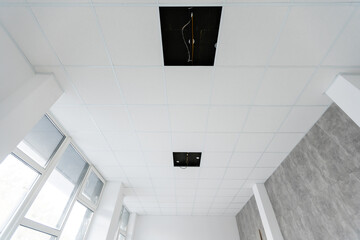Ceiling and lighting inside office building.