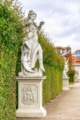 Fototapeta premium Antique stone statues in the garden of Belvedere Palace, Vienna