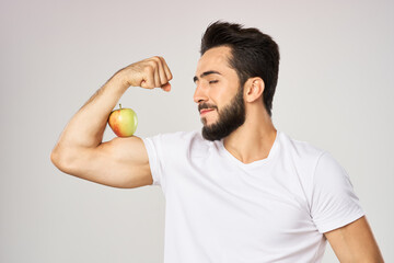 bearded man in white t-shirt apple health proper nutrition