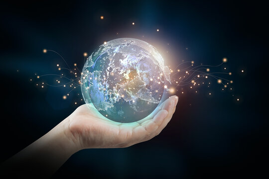 Human hands hold the world. Global Networking Concept, Future Technology (IOT). Elements of this image furnished by NASA