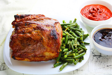 fried piece of meat on a white plate