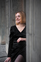 Fototapeta premium Young woman on the city balcony