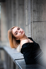 Fototapeta premium Young woman on the city balcony