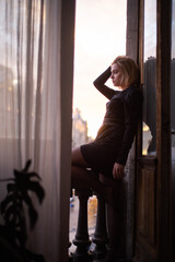 young woman near window at home, closeup