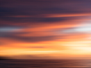 Fototapeta na wymiar Long Exposure sunset, streaky colors in the sky, wallpaper, background