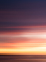 Fototapeta premium Long Exposure sunset, streaky colors in the sky, wallpaper, background