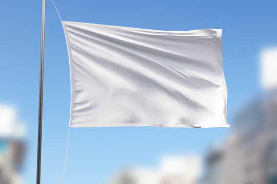 White Flag Mockup On The Blue Sky Background.