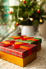 Naklejka na ściany i meble Gift boxes, fir branches, garland on the windowsill. Cozy Christmas.