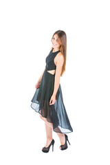 Studio shot of a beautiful young woman in black dress