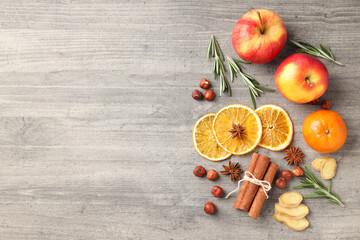 Ingredients for cooking mulled wine on wooden background