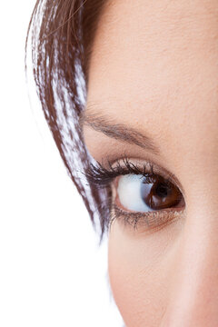 Close up of natural female eye isolated on white background