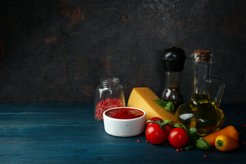 Ingredients for cooking pizza on wooden table