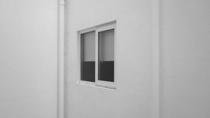the external facade of the windows of a modern white building. the exterior decoration of the building in an urban area. a simple window frame.