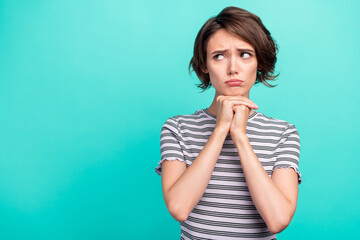 Photo of young girl unhappy sad upset offended depressed look empty space isolated over teal color background