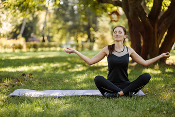 Sporty fit slim woman instructor training hatha yoga , relax breathe. 