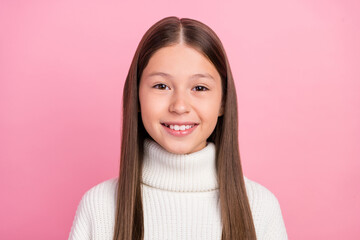 Portrait of attractive cheerful cute toothy brown-haired girl wearing soft pullover isolated over pink pastel color background