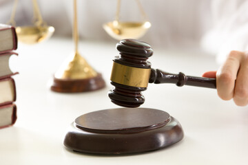 Lawyer working with contract papers and wooden gavel on tabel in courtroom. justice and law...
