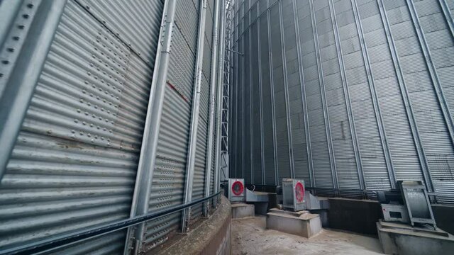 Food industry agricultural tank. Huge steel elevator storage.