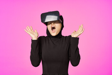 woman in black hijab glasses virtual reality technology movie watching