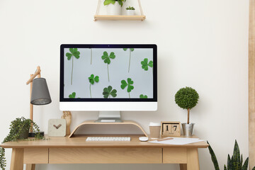 Comfortable workplace near white wall in room. Interior design