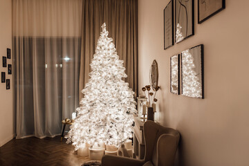 warm and cozy evening in Christmas room interior design,Xmas tree decorated by lights presents gifts,toys, deer,candles, lanterns, garland lighting indoors fireplace.holiday living room.magic New year