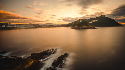 Obraz premium San Sebastián, Donostia, Spain. Coastal Cityscape Basque Country Region In Northern Spain During Epic Dramatic Amazing Warm Sunset.