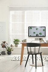 Stylish room interior with comfortable workplace. Home office