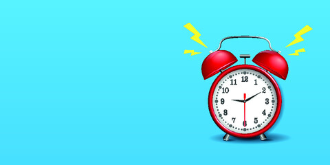 Red alarm clock on blue background