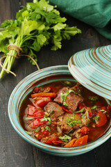 Beef goulash with vegetables closeup. Traditional Hungarian goulash soup with stew and paprika