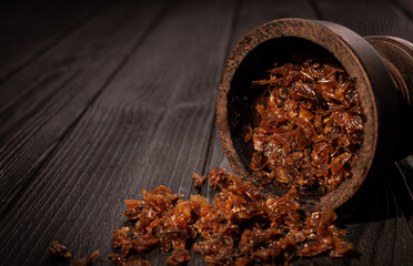 Hookah bowl with tobacco and charcoal for smoking on a dark background. Space for text. Banner