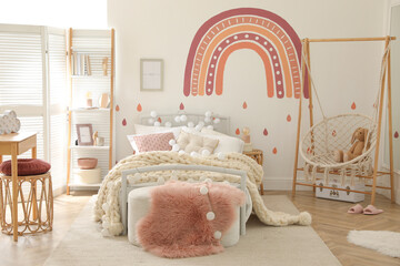 Stylish child's room interior with comfortable bed