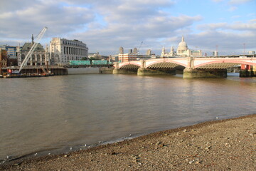 Naklejka premium London, England / UK - September 3 2021: Landscape city view with skyscrapers on River Thames from south bank by Vauxhall Bridge Tate Modern and Globe theatre historic St Paul's cathedral background