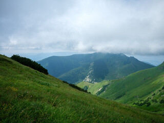 Fototapeta premium misty mountain tops in Slovenia national park