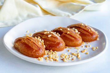 Delicious turkish sweet sekerpare on served. Traditional Turkish dessert sekerpare on a white background