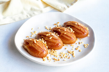 Delicious turkish sweet sekerpare on served. Traditional Turkish dessert sekerpare on a white background