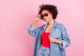 Photo of charming pretty lady toothy smile wear sunglass denim jacket isolated pink color background